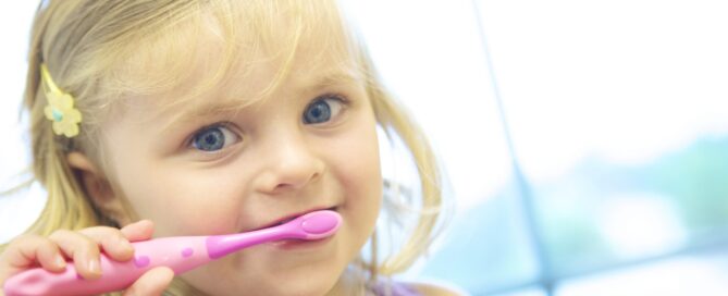 child brushing teeth