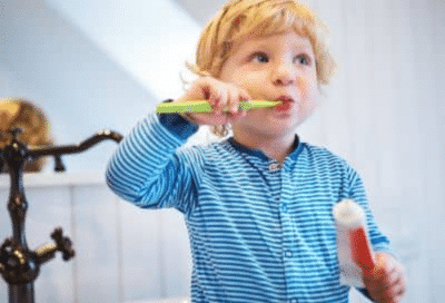 Little boy brushing his teeth