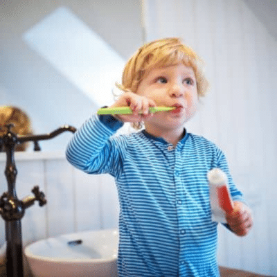 Little boy brushing his teeth