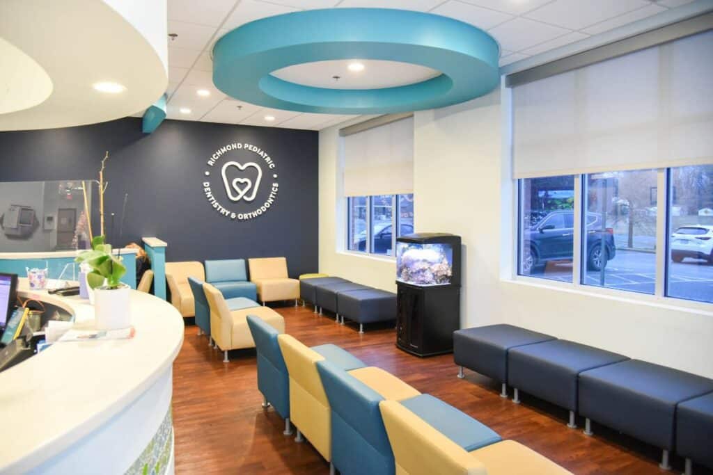 Waiting room at Richmond Pediatric Dentistry and Orthodontics with kid-sized seating and a fish tank