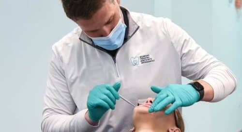 orthodontist working on patient