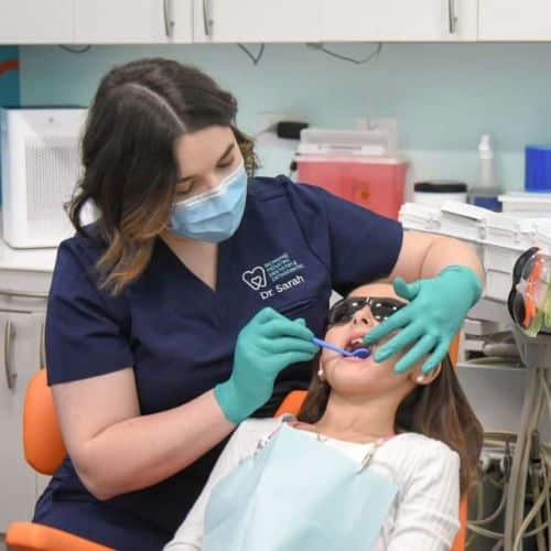 pediatric dentist evaluating patient