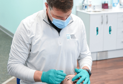 Dr. Bibona at Richmond Pediatric Dentistry & Orthodontics provides personalized orthodontics for all ages during a comfortable in-office dental exam.