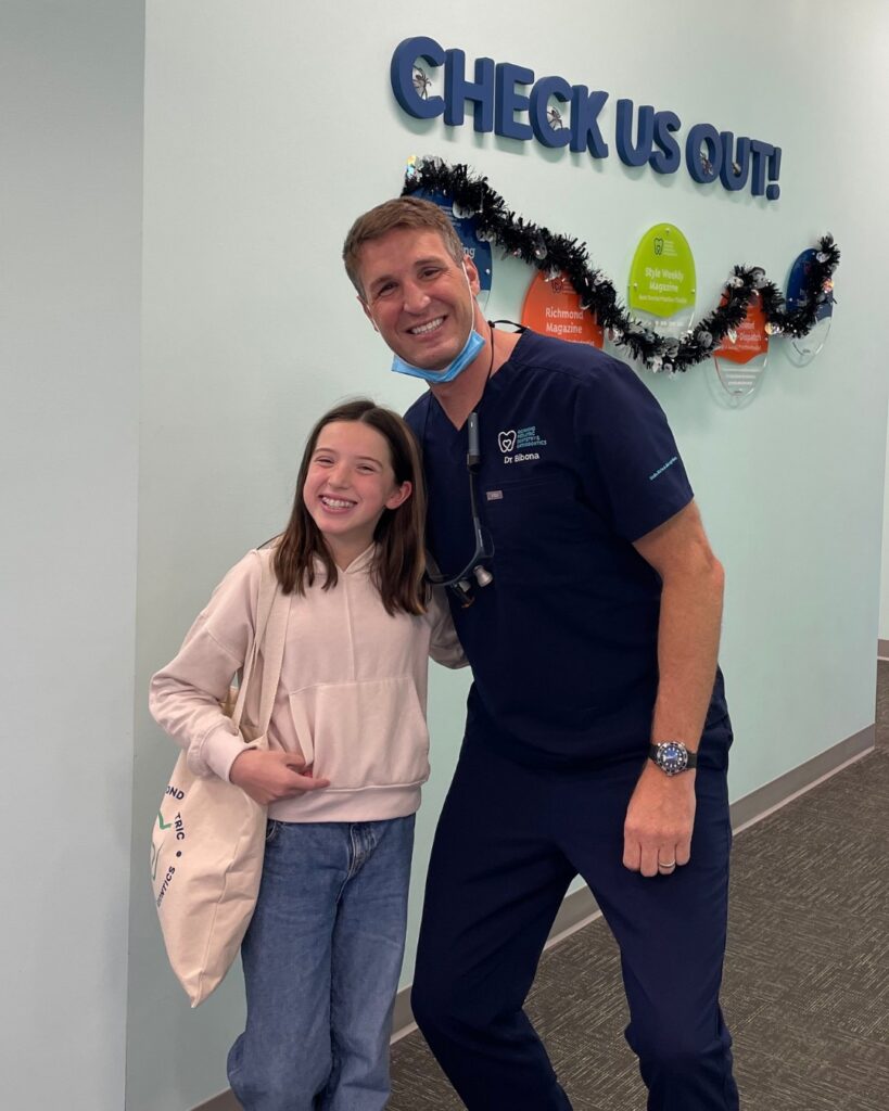 Orthodontist in Richmond, VA 4 Dr. Bibona with a young patient at the RPDO orthodontic office in Richmond, VA