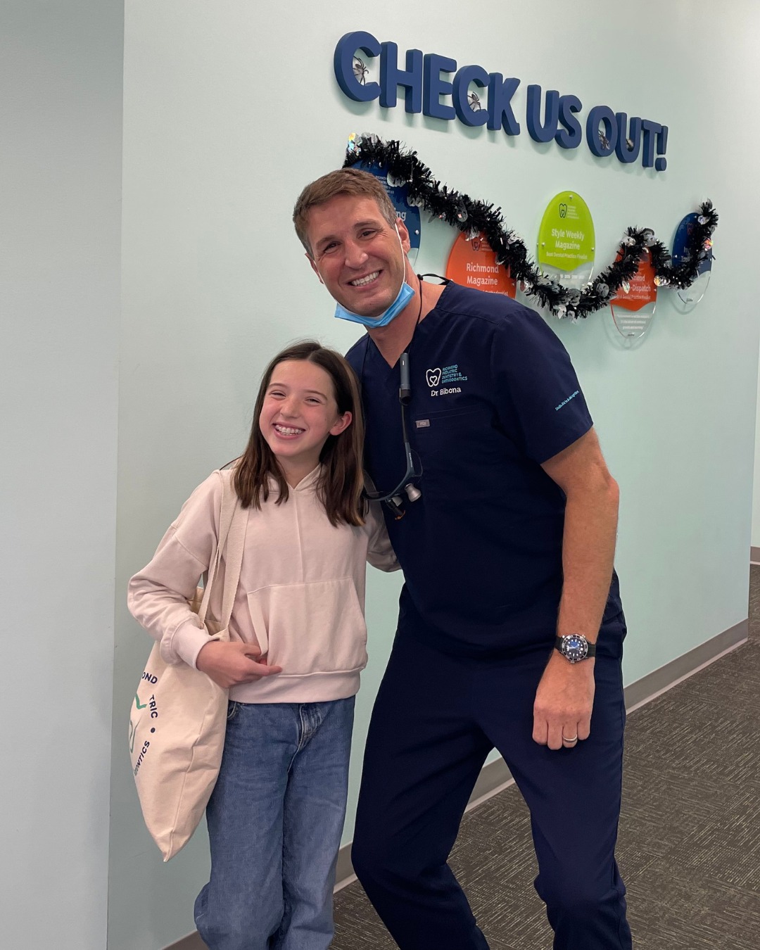 How Much Do Braces Cost in Richmond, VA? 4 Dr. Bibona with a patient at the RPDO office in Richmond, VA