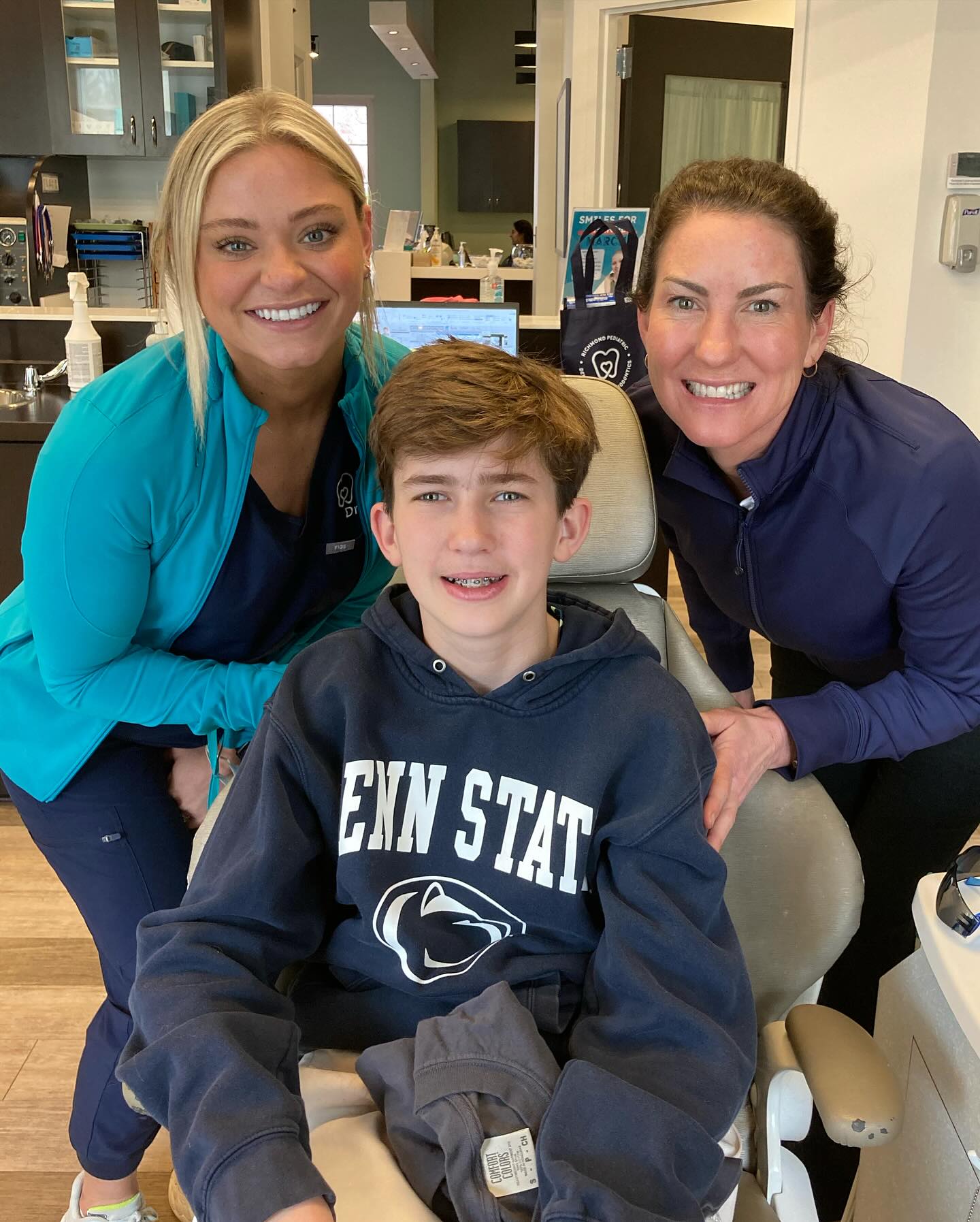 Airway Orthodontics in Richmond, VA for Breathing, Sleep & Jaw Development 3 Dr. Payton Cook, specialty-trained orthodontist, smiling with a teen patient wearing braces at Richmond Pediatric Dentistry and Orthodontics in Richmond, VA