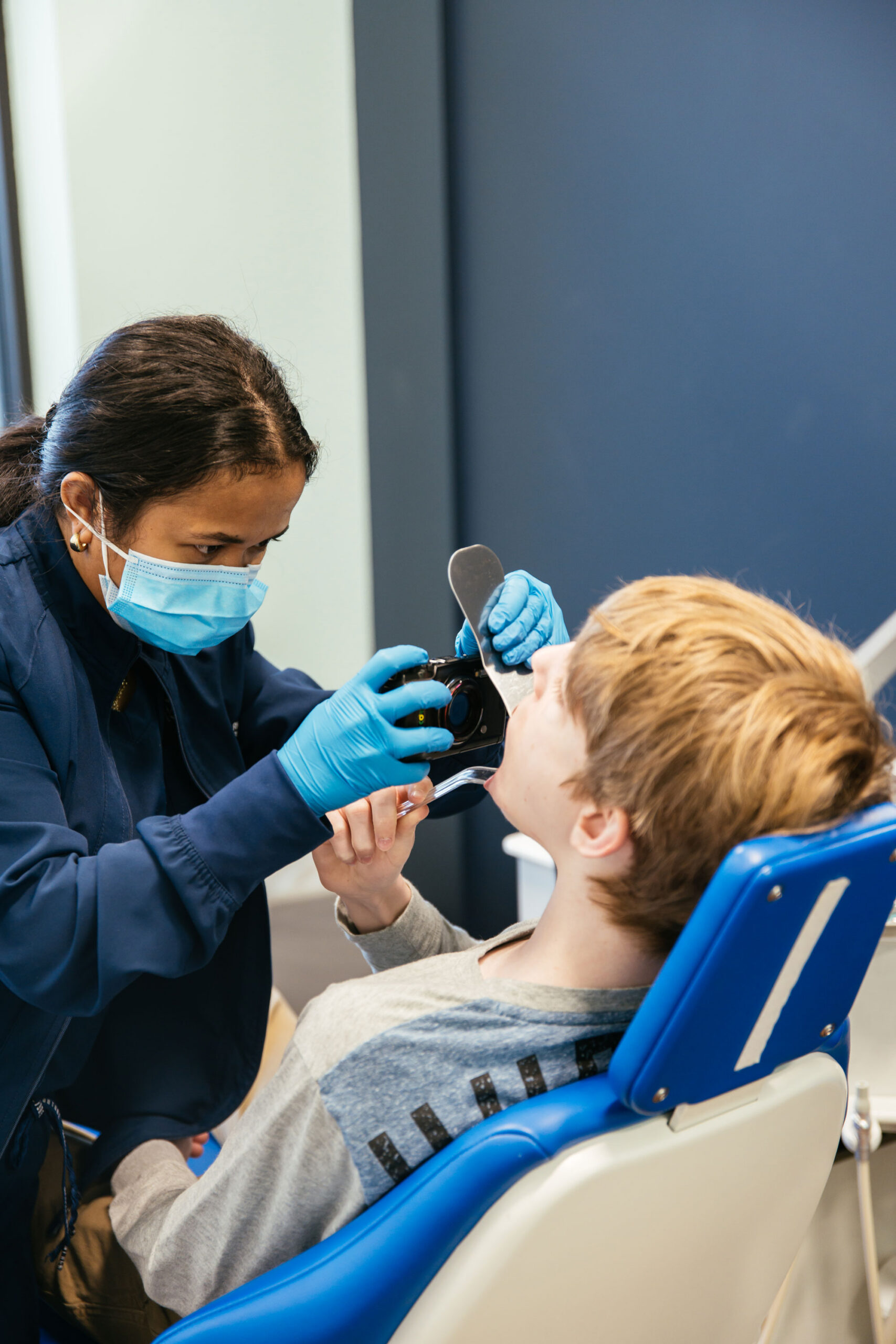 Overjet Treatment in Richmond, VA for Kids, Teens, and Adults 2 Specialty-trained orthodontist evaluating a child's teeth for overjet at Richmond Pediatric Dentistry and Orthodontics in Richmond, VA