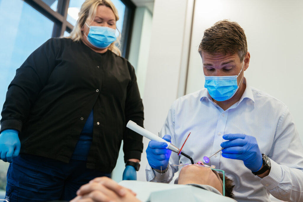 Orthodontist in Richmond, VA 14 RPDO orthodontic team bonding braces for an adult patient in Richmond, VA
