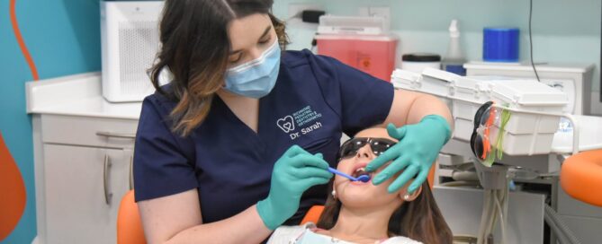 Emergency Pediatric Dentist in Richmond, VA | RPDO 2 Dr. Sarah Yi examining a young patient at Richmond Pediatric Dentistry and Orthodontics in Richmond, VA