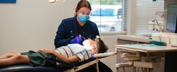 Pediatric Dentist in Glen Allen, VA 3 Pediatric dental team member polishing a young boy's teeth during a routine cleaning at Richmond Pediatric Dentistry & Orthodontics, serving Glen Allen VA families