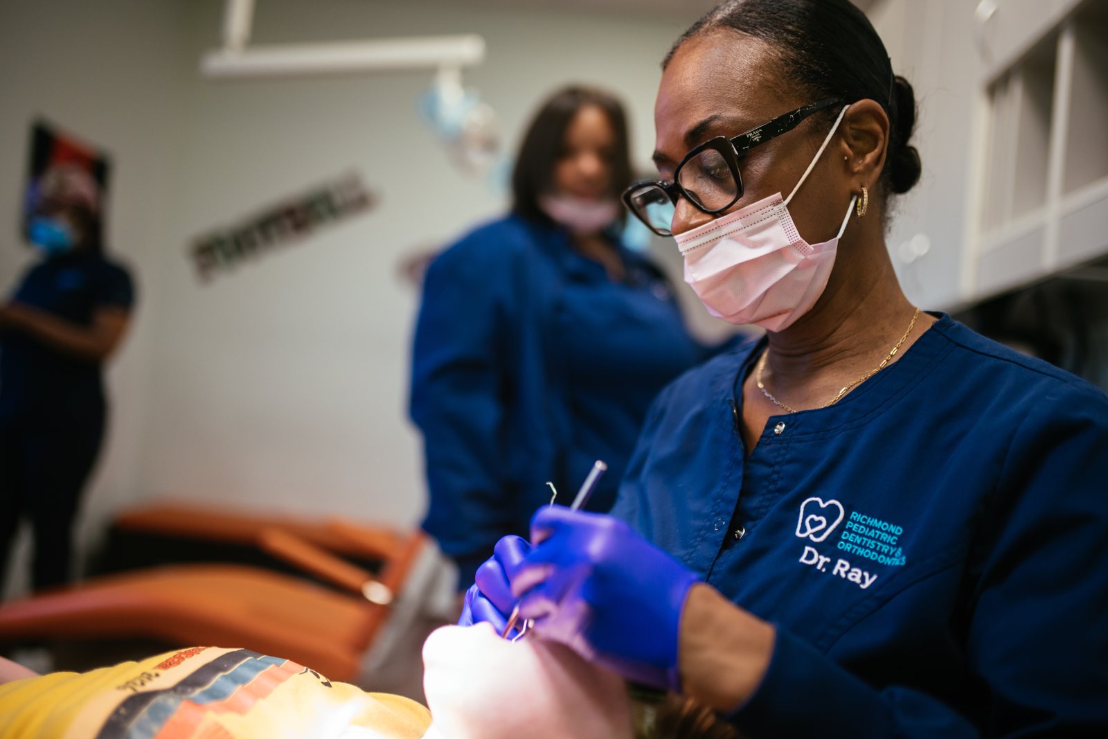Pediatric Dentist & Orthodontist in Midlothian, VA | RPDO 6 Dr. Raymonia Eddleton, pediatric dentist, treating a child at RPDO