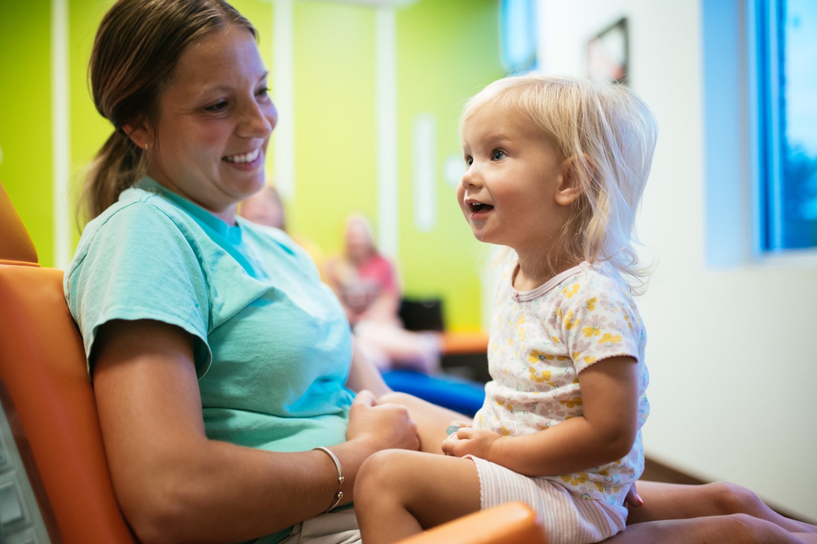 Pediatric Dentist & Orthodontist in Midlothian, VA | RPDO 4 Child laughing with a parent during a pediatric dental visit near Midlothian, VA