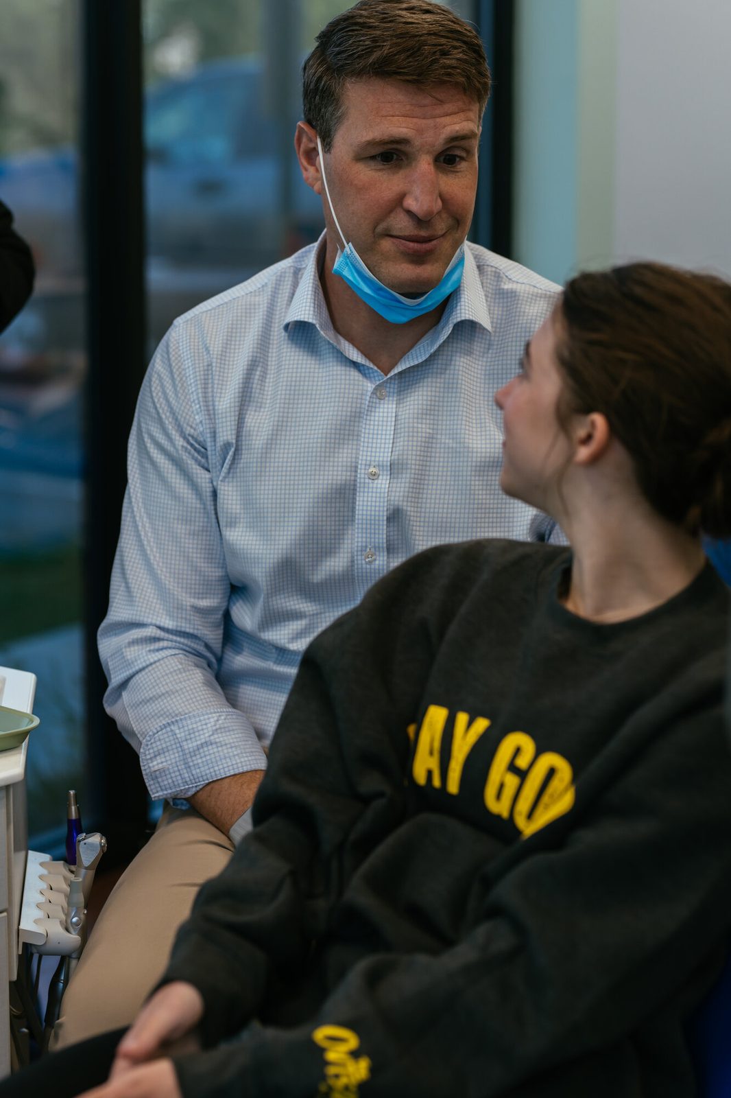 Richmond orthodontist Dr. Kevin Bibona talking with a teen patient during an orthodontic consultation at RPDO