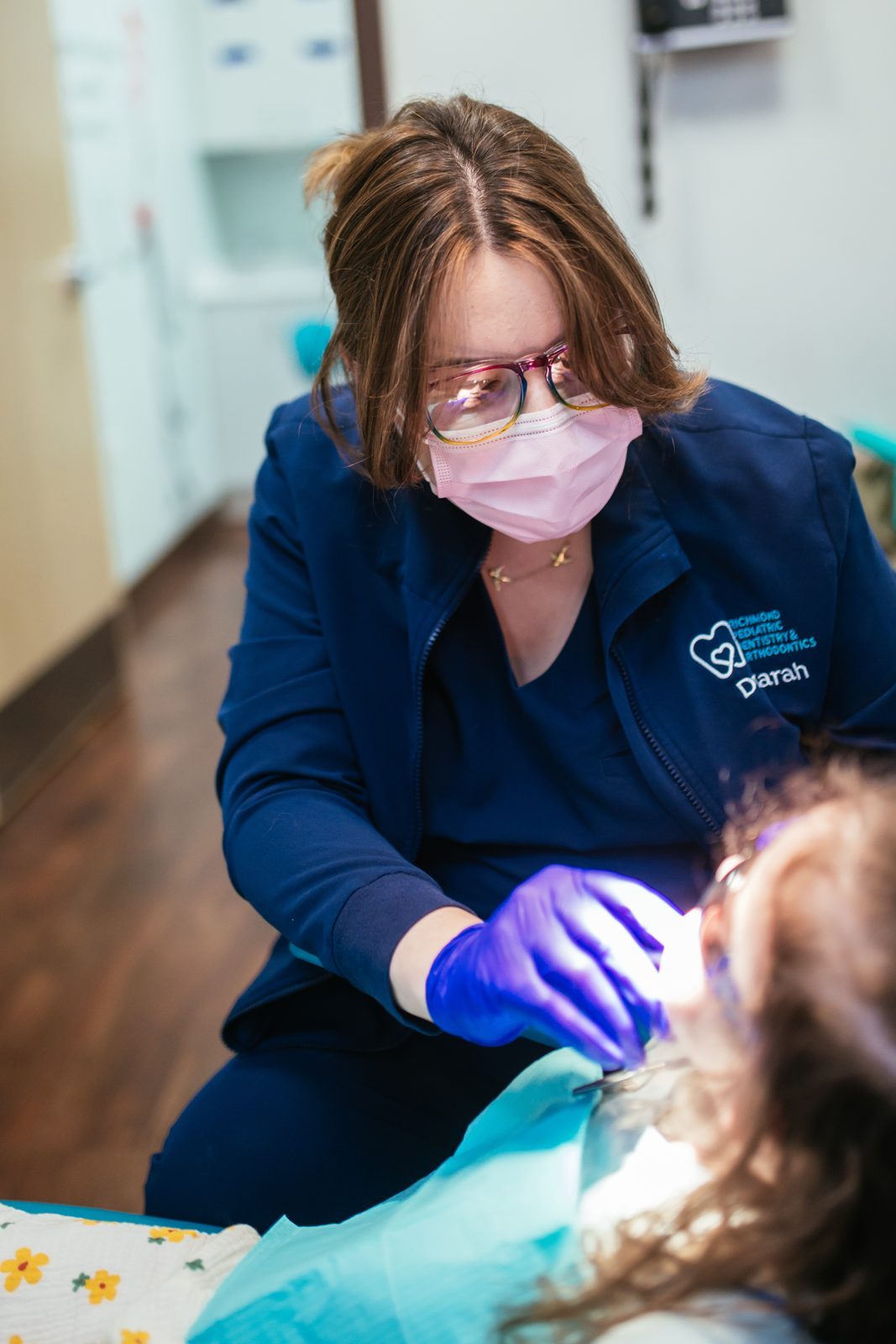 Restorative Dentistry 5 Dr. Sarah Yi, pediatric dentist, works on a young girl's baby teeth at Richmond Pediatric Dentistry and Orthodontics in Richmond, VA
