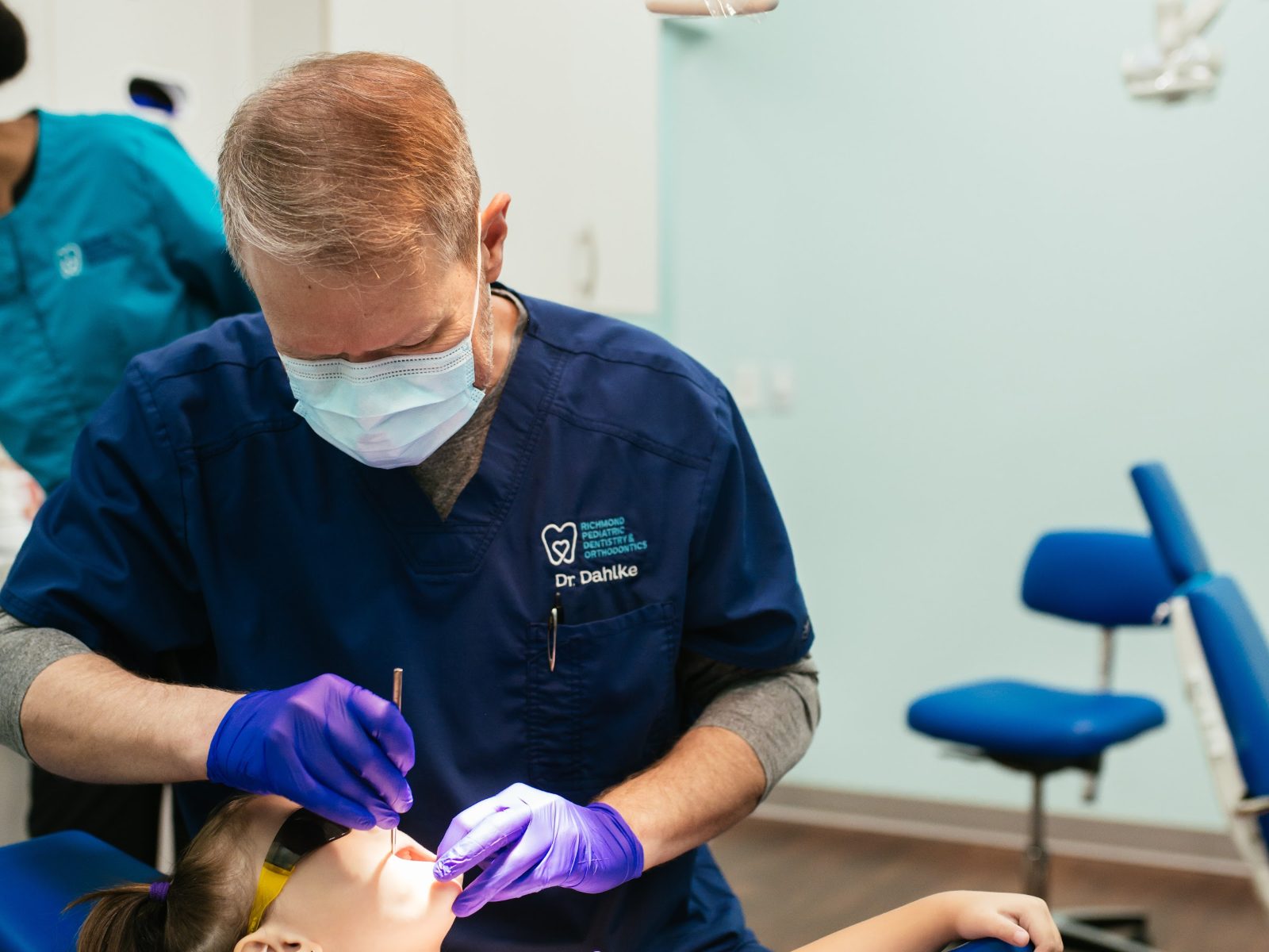 Teeth Cleaning for Kids in Richmond, VA 8 Pediatric dentist checking a child's teeth after a cleaning at RPDO in Richmond, VA