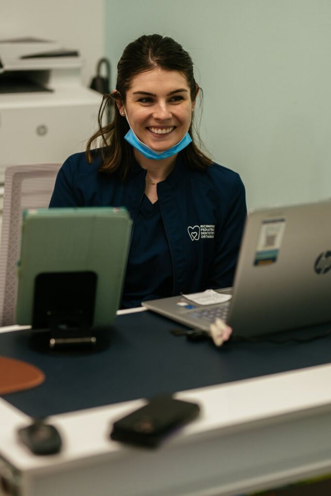 Pediatric Dentist in Chesterfield, VA 4 RPDO front desk team member ready to check a child's dental benefits, for Chesterfield, VA families