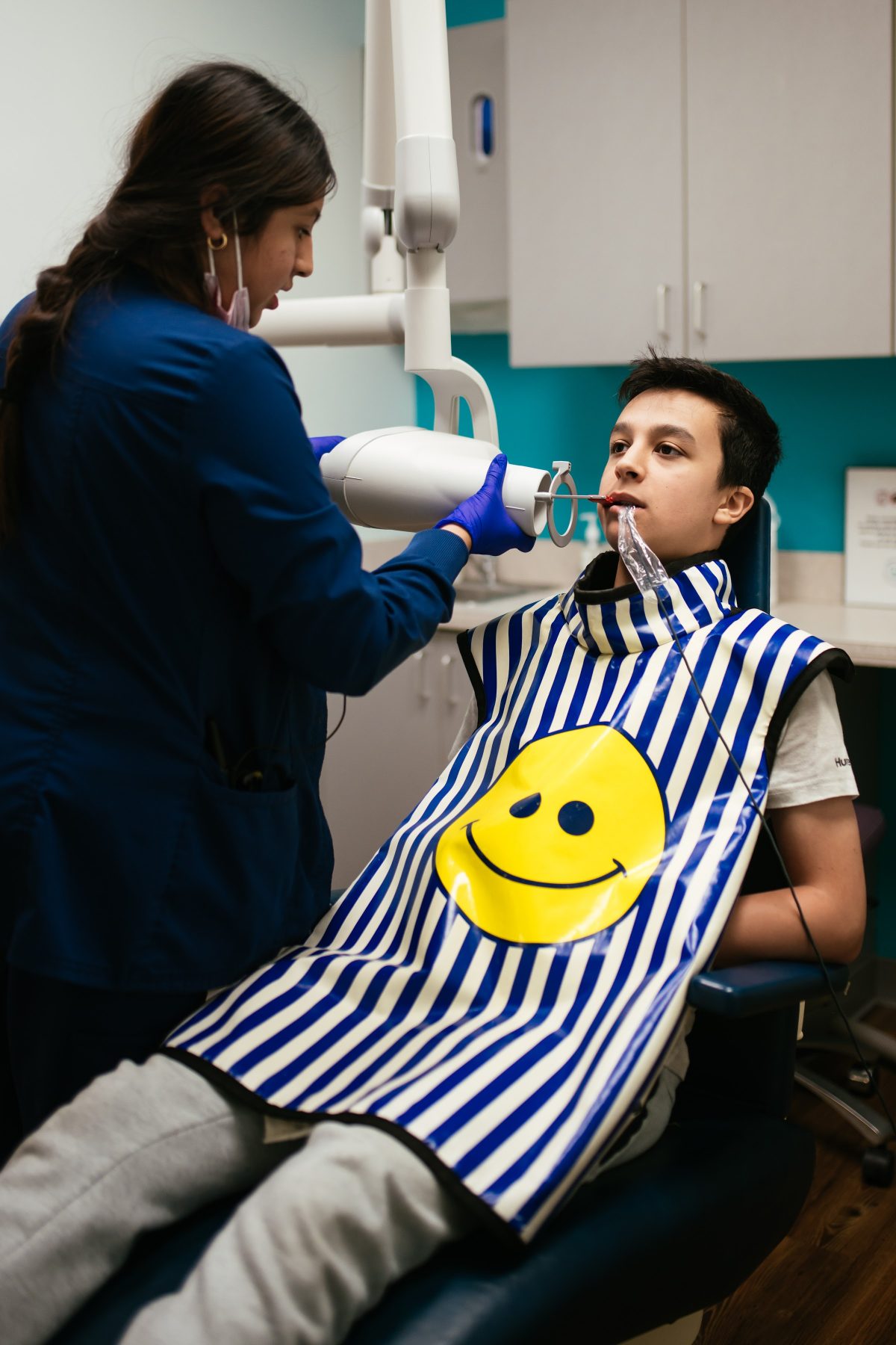 Teeth Cleaning for Kids in Richmond, VA 4 RPDO hygienist working with a teen patient at a dental visit in Richmond, VA