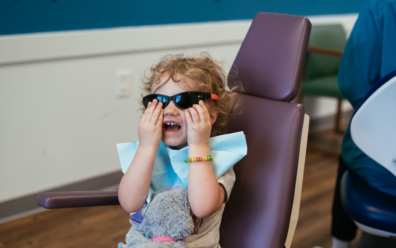 Teeth Cleaning for Kids in Richmond, VA 5 Toddler in fun sunglasses in the dental chair at RPDO in Richmond, VA